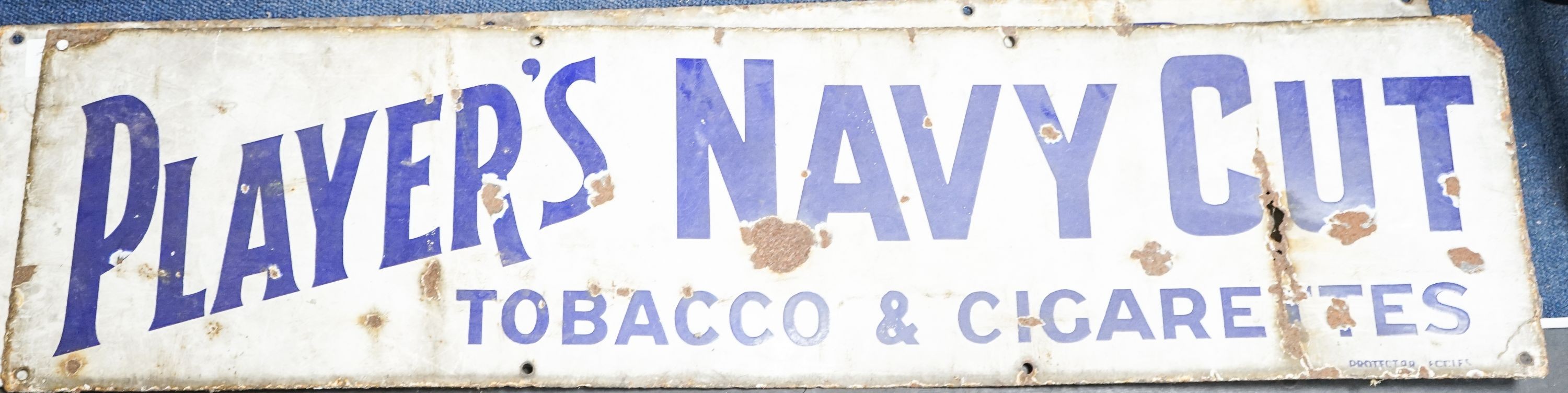 Three enamel advertising signs, 'Players navy Cut' and 'Weights', widest 91 cm